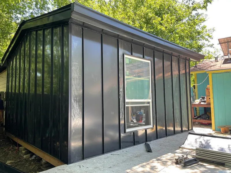 Black standing seam metal wall panels for Metal Roof Installation in Arlington